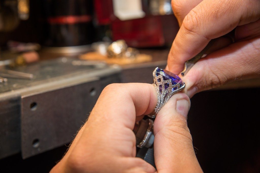 Jeweler fixing a ring