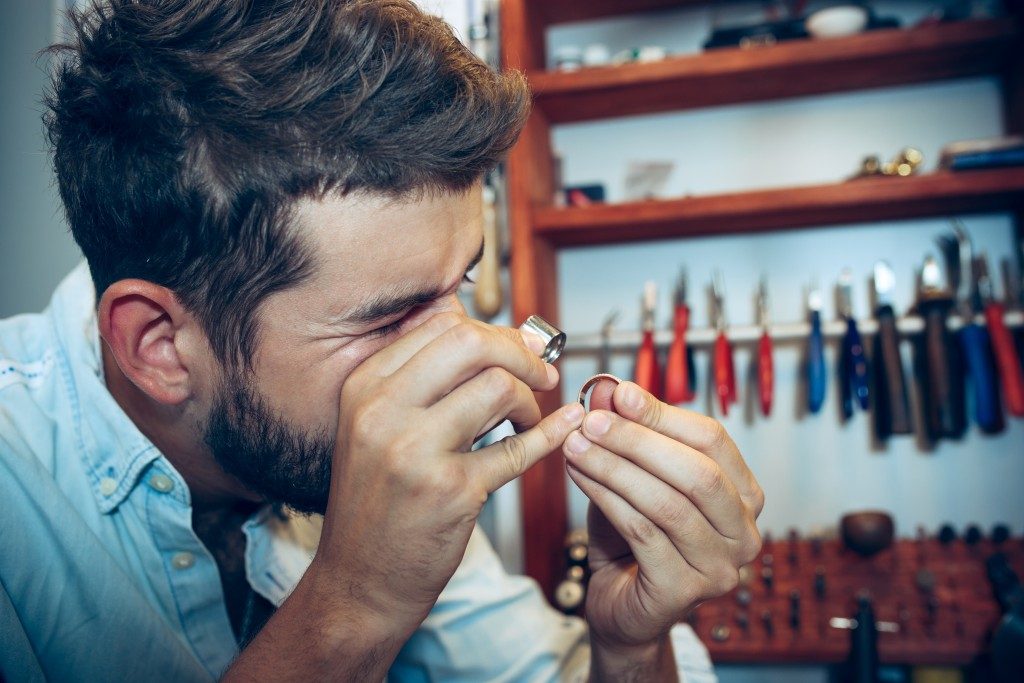 Jeweler looking at a ring