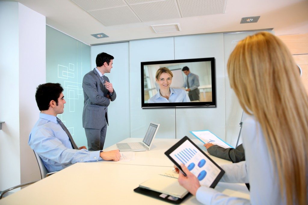 Business people watching a company video