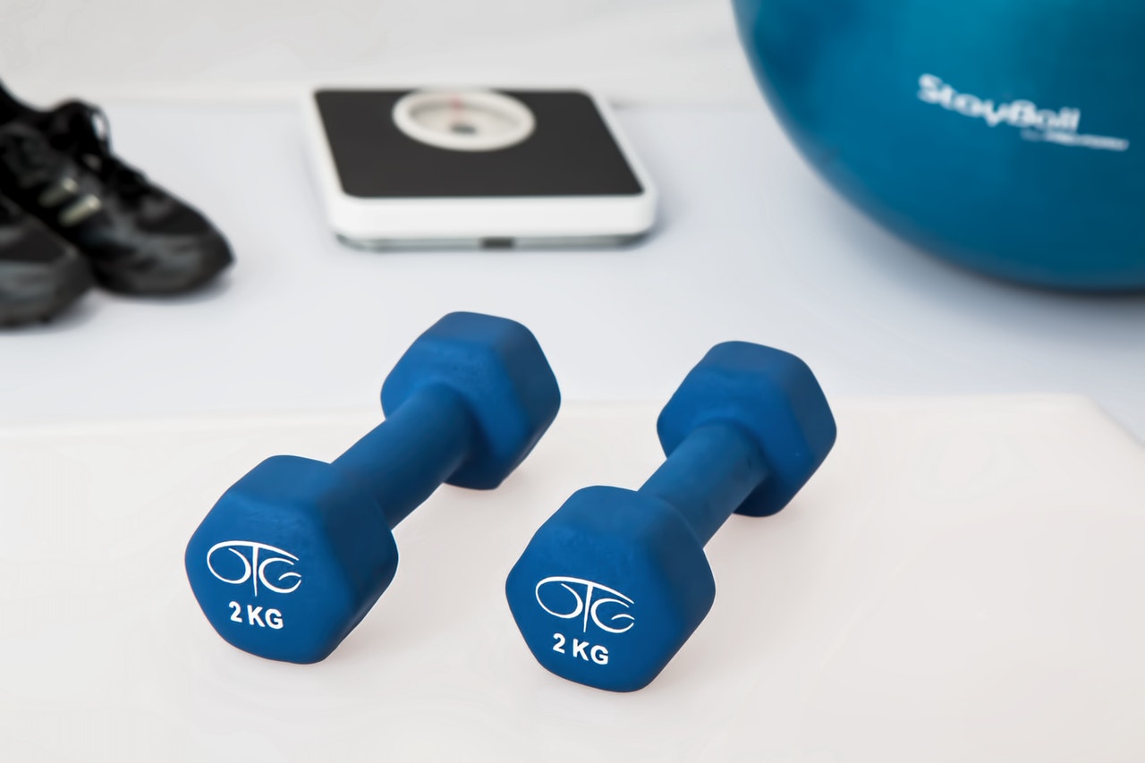 dumbbells with company logo
