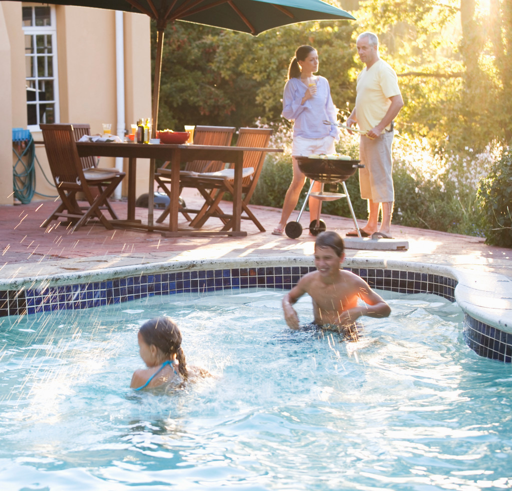 A family enjoying the home swimming pool