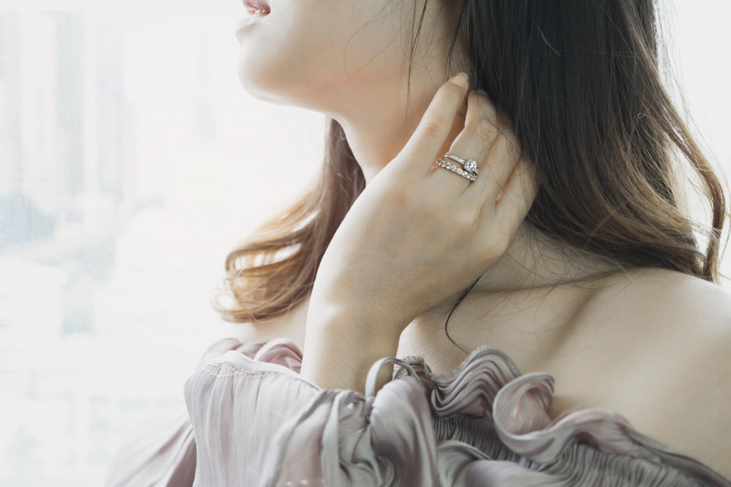 a woman wearing diamond ring